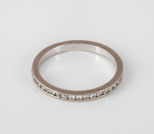A platinum and diamond eternity ring, set with 39 diamonds.