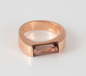 A 9ct pink gold ring, set with a rectangular cut pink tourmaline, 7.1 grams.