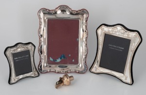 Two English sterling silver photo frames, two graduated of the same pattern by&nbsp;Arthur Price & Co. of London. The third silver plated; together with a sterling silver wine pourer with original stopper made by Mappin & Webb of Sheffield, 20th century, (4 it