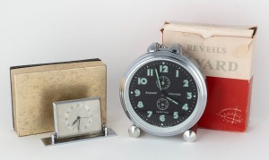 Two Vintage alarm clocks, 'Bayard, Stentor, Repetition' made in France art deco style in nickel plated case with black dial and arabic numerals, together with a traveling alarm clock in nickel plated case on adjustable plinth stand. Both with original pac