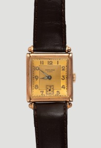 Dunklings&nbsp;"RIVANA"&nbsp;gents tank style manual wristwatch. Square dial with Arabic numerals and subsidiary seconds at the 6 position. 15 jewel Swiss movement in a 9ct gold case made by Handley, housed in a period "Dunklings The Jewellers"&nbsp;branded case, circa 