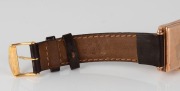 Dunklings&nbsp;"RIVANA"&nbsp;gents tank style manual wristwatch. Square dial with Arabic numerals and subsidiary seconds at the 6 position. 15 jewel Swiss movement in a 9ct gold case made by Handley, housed in a period "Dunklings The Jewellers"&nbsp;branded case, circa - 2