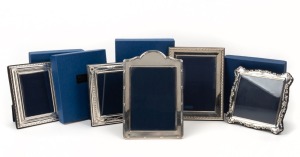 A group of five English sterling silver photo frames, four made by Whitehill, Silver & Plate Co. of Sheffield (in original boxes);&nbsp;the fifth made by Carrs of Sheffield,&nbsp;late 20th century, the largest 24cm high, 16.5cm wide.