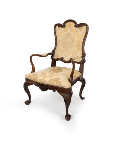 An antique French Louis XVI period walnut fauteuil&nbsp;armchair with shepherd's crook armrests, scroll and floral carved frame with ball and claw cabriolet legs with acanthus carved knees and front rail, circa 1790, 118cm high, 72cm across the arms