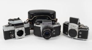 IHAGEE: Three c. 1960s SLR cameras - one Exakta Varex IIa camera body with body cap, one Exakta VX500 with Domiplan 50mm f2.8 lens and matching leather case, and one Exakta RTL 1000 camera body. (3 cameras)