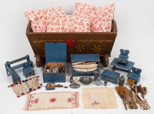 An antique Northern European folk art dolls cradle; together with an attractive selection of hand-made folk art dolls house furniture and accessories with blue painted finish, dated 1937, the cradle 44cm long