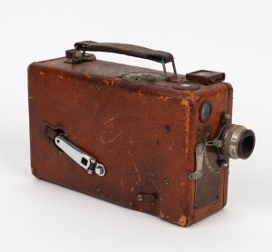 KODAK: Red-body Cin&eacute;-Kodak Model B 16mm movie camera, c. 1925, with 25mm f1.9 lens.