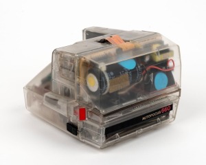 POLAROID: Rare transparent-body Polaroid Autofocus 660 instant camera, c. 1986. Produced in extremely limited numbers in order to showcase the camera's inner workings to prospective customers.