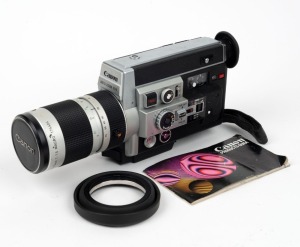 CANON: Auto Zoom 1014 Electronic Super-8 movie camera, c. 1973, with Macro 7-70mm f1.4 lens, lens cap, lens hood, and instruction booklet.