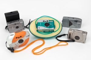 VARIOUS MANUFACTURERS: Five c. 1990s APS film cameras - one Canon Ixus Concept,&nbsp;one Ixus Concept Summer in plastic case, one Canon Ixus FF in leather pouch, one Kodak Advantix T550, and one Nikon Nuvis A20. (5 cameras)