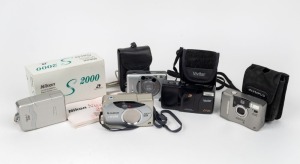 VARIOUS MANUFACTURERS: Five c. 1990s APS cameras - one Canon Ixus L-1 in maker's leather pouch, one Fujifilm Nexia 3100ixZ, one Nikon Nuvis S 2000 in maker's box with instruction booklet, one Olympus iZoom 2000 in maker's pouch, and one Vivitar Z360ix Dat