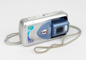 NIPPON KOGAKU: Nikon Coolpix 2500 digital camera, c.&nbsp;2002,&nbsp;with unusual reversible pivoting lens and memory card.