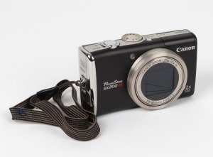 CANON: PowerShot SX200 IS digital camera [#8778100536], c. 2009, with battery pack and memory card.