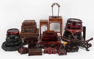 An accumulation of assorted Chinese carved timber stands, mostly 20th century, (qty).