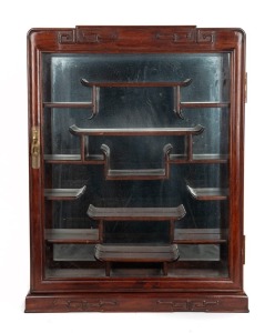 A Chinese rosewood wall mounted display cabinet with mirrored back interior, 20th century, ​​​​​​​61cm high, 46cm wide, 10cm deep