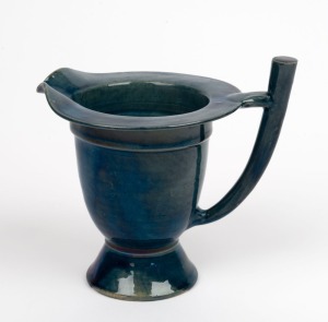 An English Arts & Crafts blue glazed pottery jug in the manner of Christopher Dresser, 19th/20th century, 14cm high