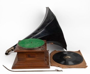 The "New Cecil" Zonophone vintage oak cased table-top gramophone, with horn, (missing stylus and bracket), early 20th century, together with a record, approximately 80cm high&nbsp;