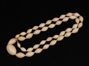 An impressive Chinese carved ivory bead necklace, 19th/20th century, ​​​​​​​the largest bead 3.5cm wide, 90cm long