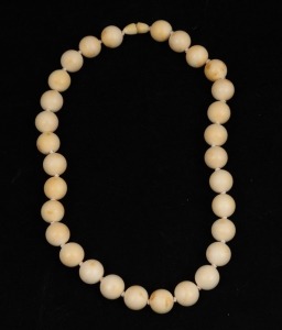 A vintage turned ivory bead choker necklace, early to mid 20th century, ​​​​​​​46cm long.