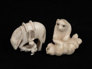 Two Japanese carved ivory netsukes, comprising of a bear figural group, and a horse with rider inspecting it's hooves, 19th/20th century, ​​​​​​​the larger 4.2cm high