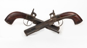 A pair of percussion cap pistols in the antique style, with octagonal barrels and walnut stocks, 20th century, 27cm long
