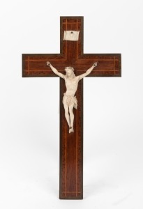 An antique carved ivory crucifix mounted on an inlaid timber cross, 19th century, 34cm high
