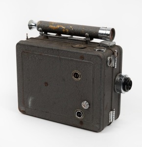 DEVRY: Circa 1926 35mm hand-cranked Devry 'Lunchbox' Standard Portable Camera, with Wollensak Velostigmat f2.8 lens and internally-stored locking lens cap.