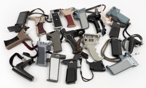 VARIOUS MANUFACTURERS: Twenty screw-on 8mm/Super 8-type movie camera handles, many with trigger mechanism. (20 items)