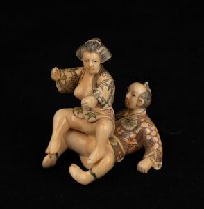 A Japanese carved ivory two piece erotic okimono&nbsp;with hand-coloured finish, early to mid 20th century, ​​​​​​​6cm high
