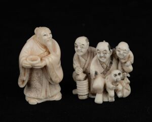 A Japanese carved ivory netsuke of a standing old man with alms bowl (seal mark to base); together with a figural group example with monkey also in carved ivory, 19th/20th century, (2 items), ​​​​​​​the larger 5cm high
