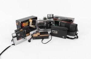 VARIOUS MANUFACTURERS: Eight c. 1980s disc-film cameras - one Ansco Fiesta-Disc in underwater housing, one Hanimex 208 in maker's box, one Hanimex Snap Shooter 115, two Kodak Disc 3500 models, one Kodak Disc 4000 in maker's box, one Kodak Disc 6000, and o