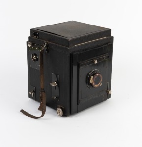 All-black 16 x 11cm plate SLR camera with Meyer-Double-Anastigmat No. 3 8&frac14;" f6.8 lens and leather lens cap.