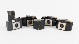 KODAK: Group of four different c. 1950s Brownie 127 cameras, together with one c. 1934 Baby Brownie. (5 cameras)