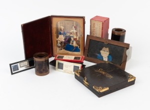 Mixed group of items, including one 'Shomescope' photograph viewer, one 'slippin' slide', two 70mm film strips, one box of Roama Film Strip Stories, and seventeen 13 x 6cm or smaller glass stereo slides. (23 items)