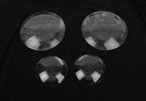 Group of four magic lantern condenser lenses - two 16cm diameter, two 19cm diameter. (4 items)