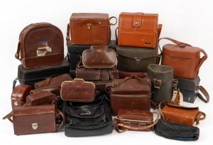 VARIOUS MANUFACTURERS: Accumulation of twenty-four vintage leather movie camera cases, from brands such as Bolex-Paillard, Eumig, Kodak, Leitz, Zeiss Ikon, and others. (24 items)
