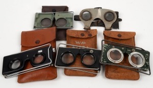 Group of five c. 1910s collapsible metal pocket stereoscopes, four of which in leather pouches. (5 items)