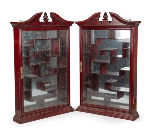 A pair of vintage Chinese style wall display cabinets with mirrored backs and geometric shelving arrangement, late 20th century, 84cm high, 53cm wide, 12cm deep.