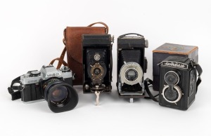 VARIOUS MANUFACTURERS: Group of four cameras - one Gomz Lubitel with Cyrillic text in maker's box, one Kodak Six-20 A, one Kodak No. 2 Folding Autographic Brownie in matching leather case, and one Minolta XG-M with lens filter and lens hood. (4 cameras)