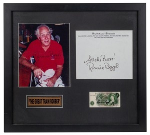RONNIE BIGGS "The Great Train Robber" signed photographic display comprising of a bank of England one pound note signed "Ronnie Biggs, Rio", a signed photograph and a signature of Ronald Biggs Rio letterhead, 50 x 55cm overall