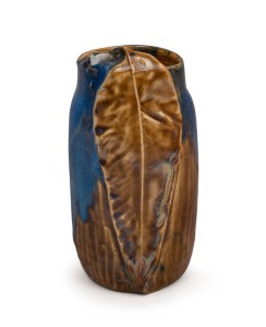 249 · PHILIPPA JAMES pottery vase with applied gum leaf decoration and unusual brown and blue high gloss glaze, incised "Philippa James" with remains of original paper label, 17cm high