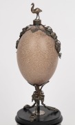 An antique emu egg ornament with silver plated mounts, emu finial and ebonised timber base, 19th century, 33cm high - 3
