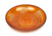 A marigold carnival glass kookaburra and waratah fruit bowl, ​​​​​​​28.5cm diameter