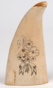 A scrimshaw whale's tooth with portrait of a lady in a crinoline dress with floral vignette verso. Note: Damaged tip. 11.5cm long - 2