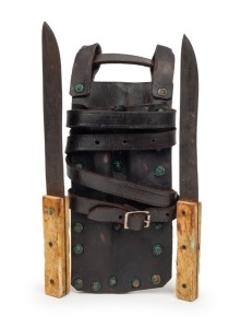 180 · A pair of antique leaning knives with whalebone handles in a user made leather twin pouch, Western Australian origin, 19th/20th century