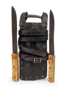 A pair of antique leaning knives with whalebone handles in a user made leather twin pouch, Western Australian origin, 19th/20th century