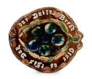 BENDIGO pottery bread platter with mottled blue and green glaze on brown ground, 19th century, 31.5cm wide