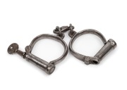 CONVICT HANDCUFFS, screw-key nickel plated #10, 19th century, ​​​​​​​24cm long