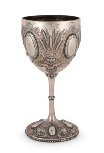 26 · WILLIAM EDWARDS (attributed) of Melbourne, antique Australian silver goblet with repousse waterlily and bulrush decoration, 19th century, stamped "STERLING SILVER", 19cm high, 284 grams total (including weighted base)