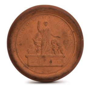 CUMBERLAND POTTERY, c1888. circular terracotta plaque made by Liebentritt & Son, 10.5cm in diameter.